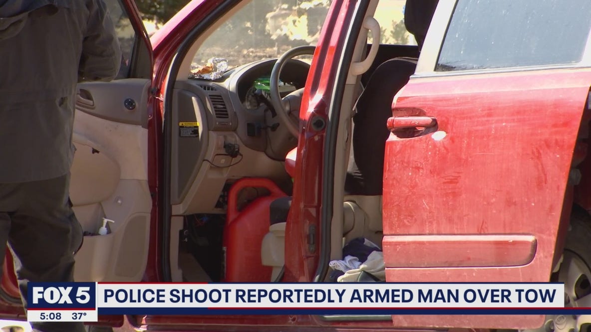 Police shoot reportedly armed man over tow